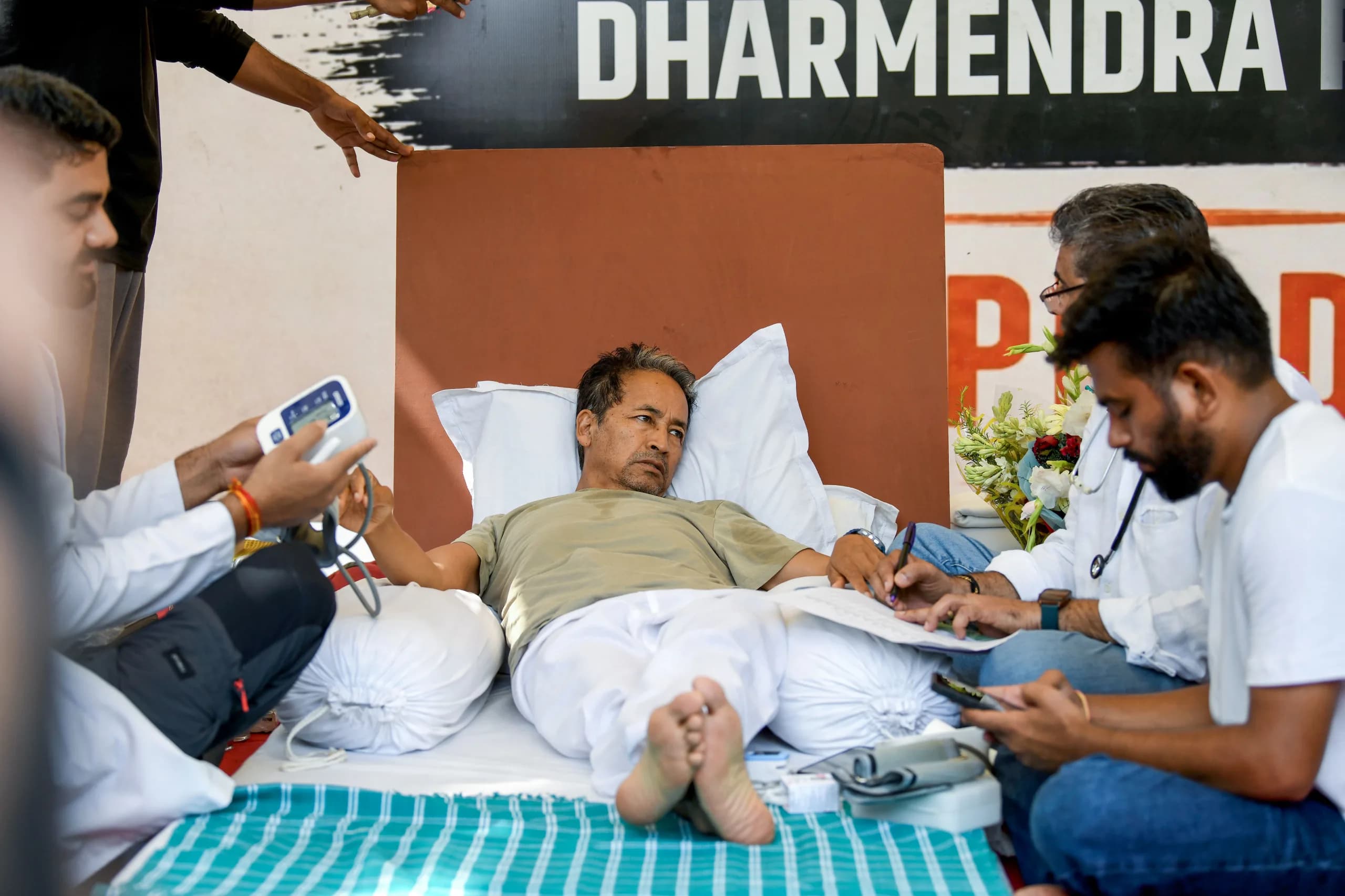 Environmentalist Sonam Wangchuk being attended by medical professionals on the 18th day of his indefinite hunger strike during a protest by the Cockroach Janata Party (CJP), demanding the Union Education Minister Dharmendra Pradhan's resignation over alleged irregularities in the NEET examination, at Jantar Mantar, in New Delhi on Wednesday. CJP founder Abhijeet Dipke present. (ANI Photo/Rahul Singh)