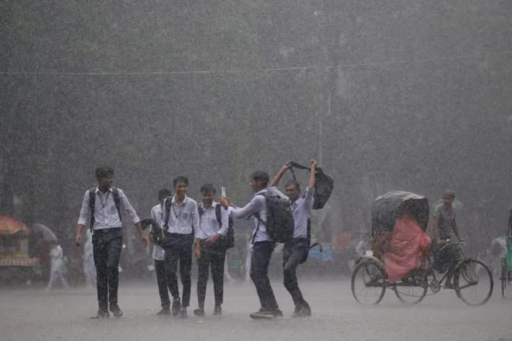 Rain clouds over Delhi as passengers arrive at Indira Gandhi International Airport following a weather advisory.